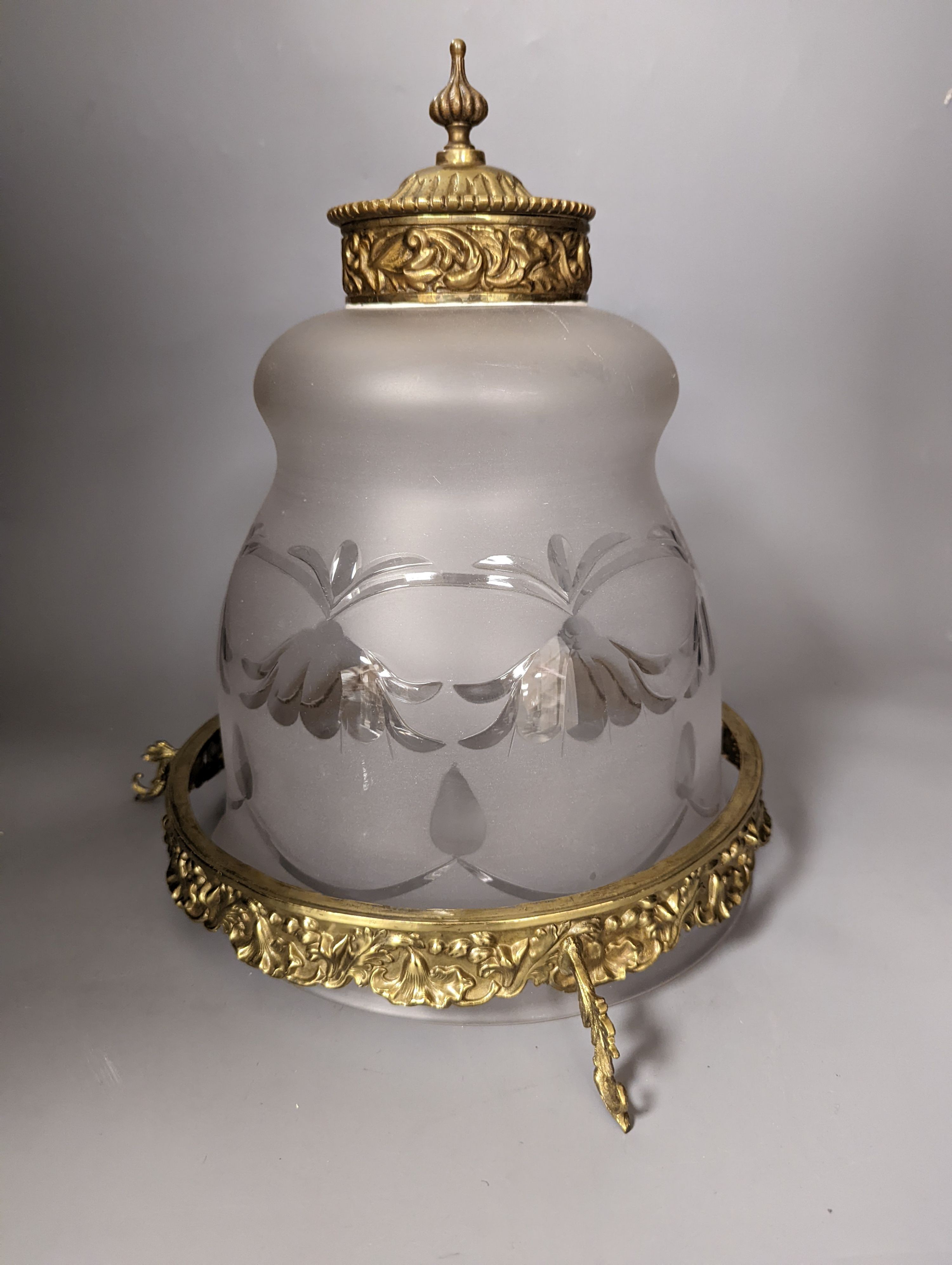 An overlaid etched glass and brass hanging light, 36 cms high, not including chain.